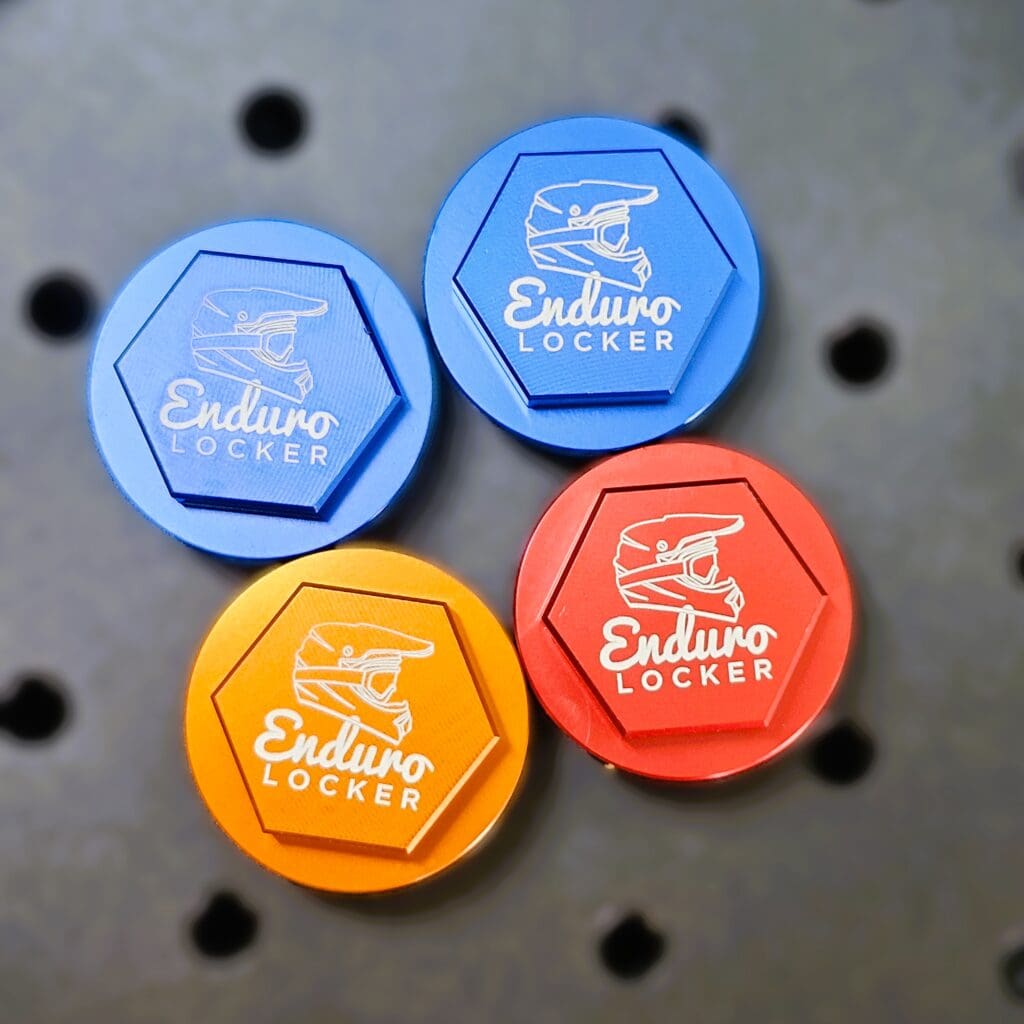 Laser-marked coloured anodised aluminium components