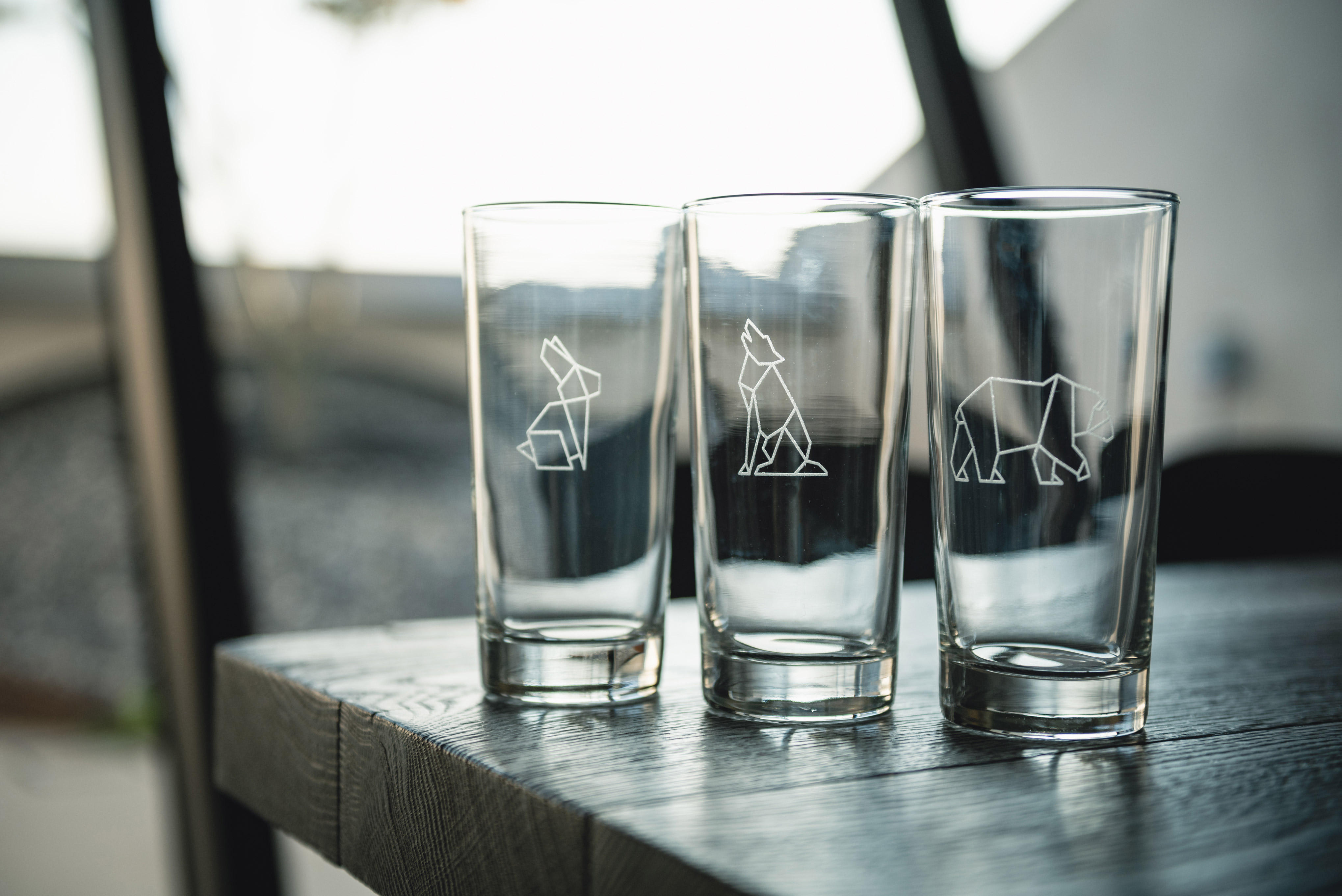 Clear glass tumblers with engraved designs