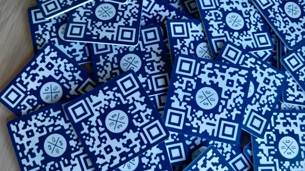 Batch of blue QR table tags prepared for hospitality use
