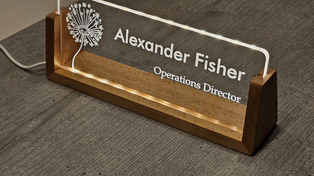 Illuminated acrylic desk name sign in a wooden base